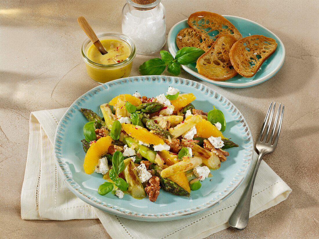 Fruity asparagus salad with oranges, walnuts, and feta cheese