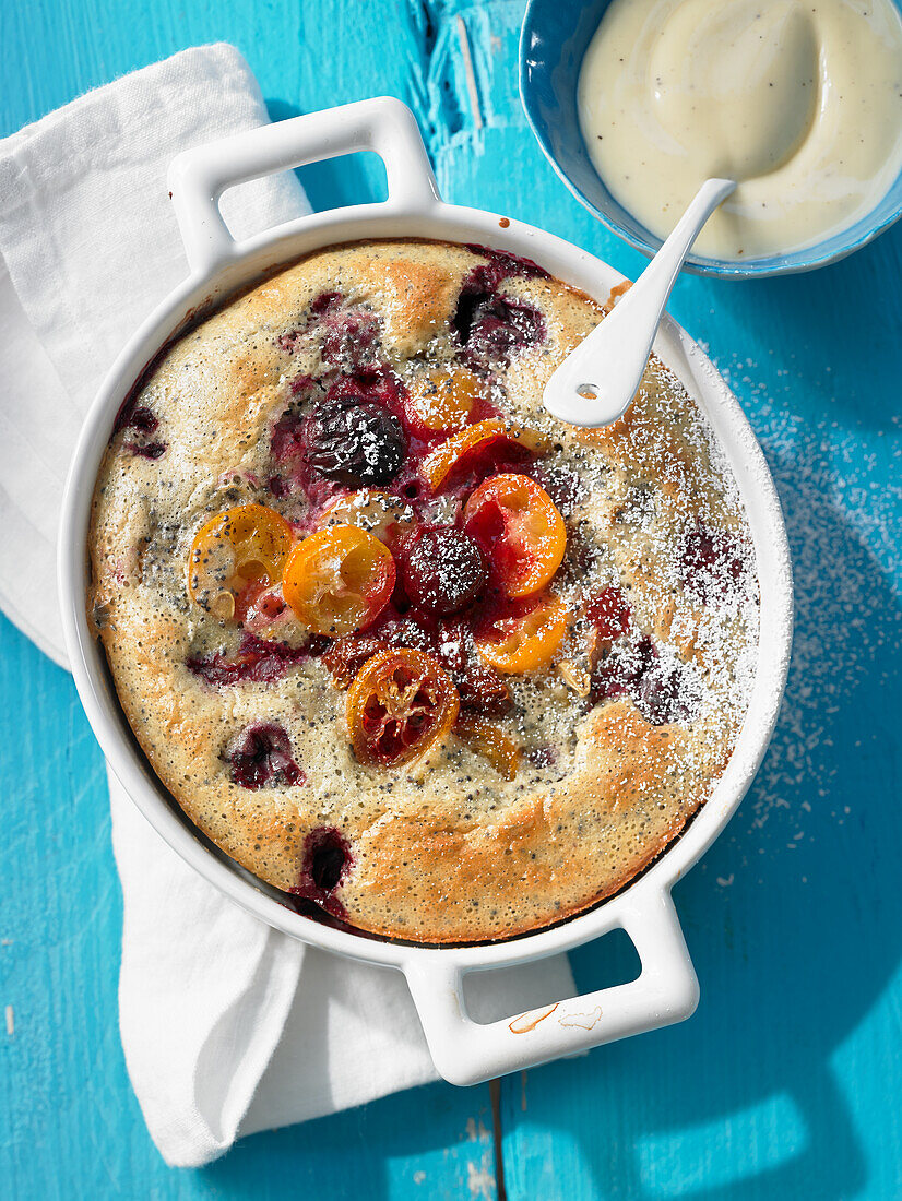 Poppy seed clafoutis with kumquats and cherries