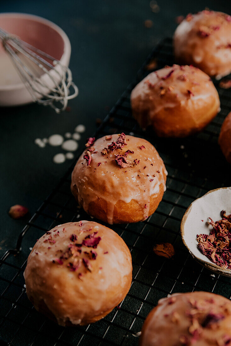 Glazed jelly donuts with dried rose petals