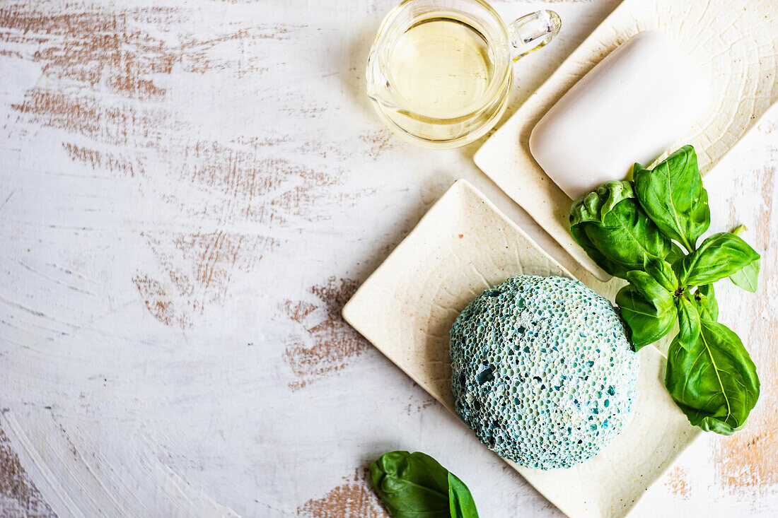 Spa and health concept with fresh basil leaves with a sponge