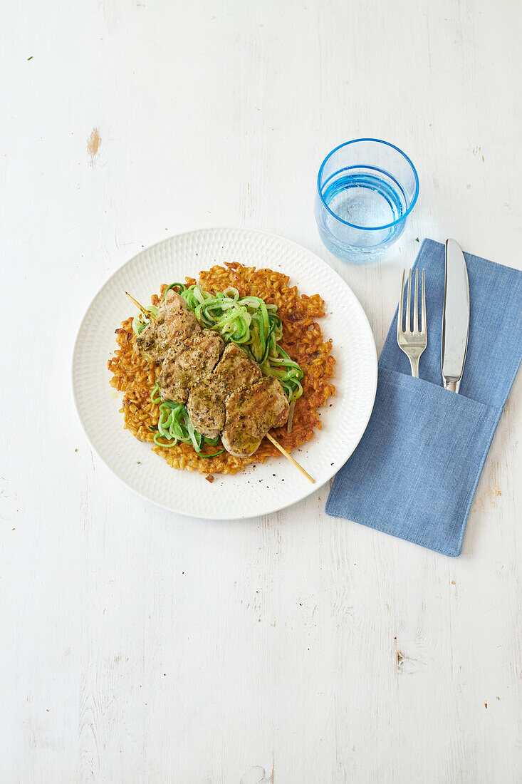 Pork skewer with wheat pancakes and zoodles