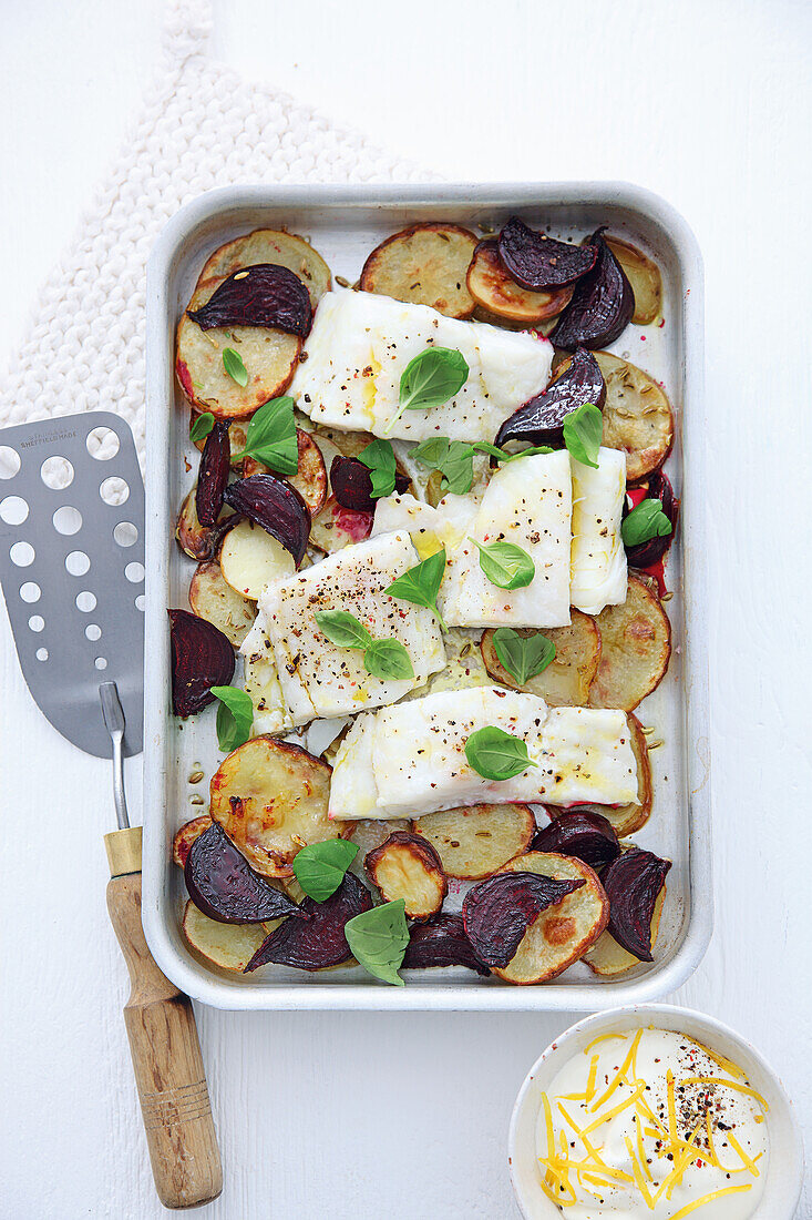 Beetroot and potato tray bake with pollack and lemon