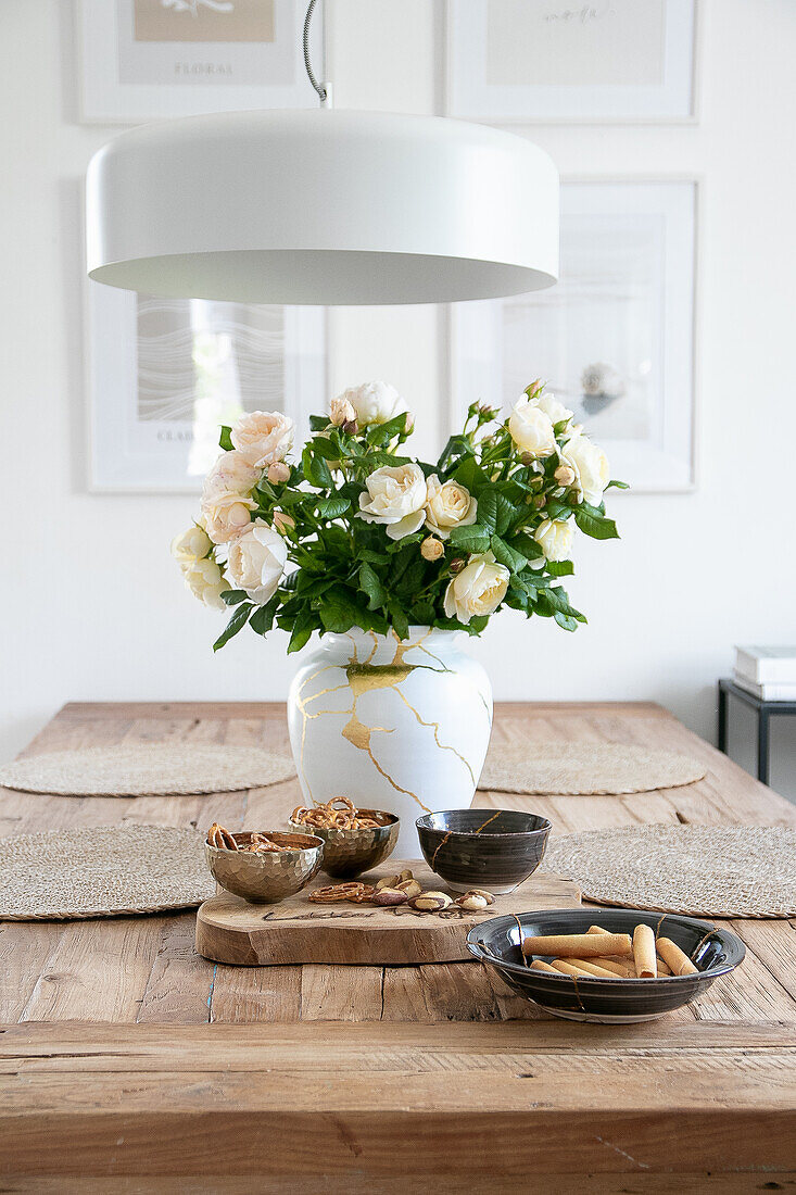 DIY Kintsugi vase (Japanese ceramic art) with flower bouquet