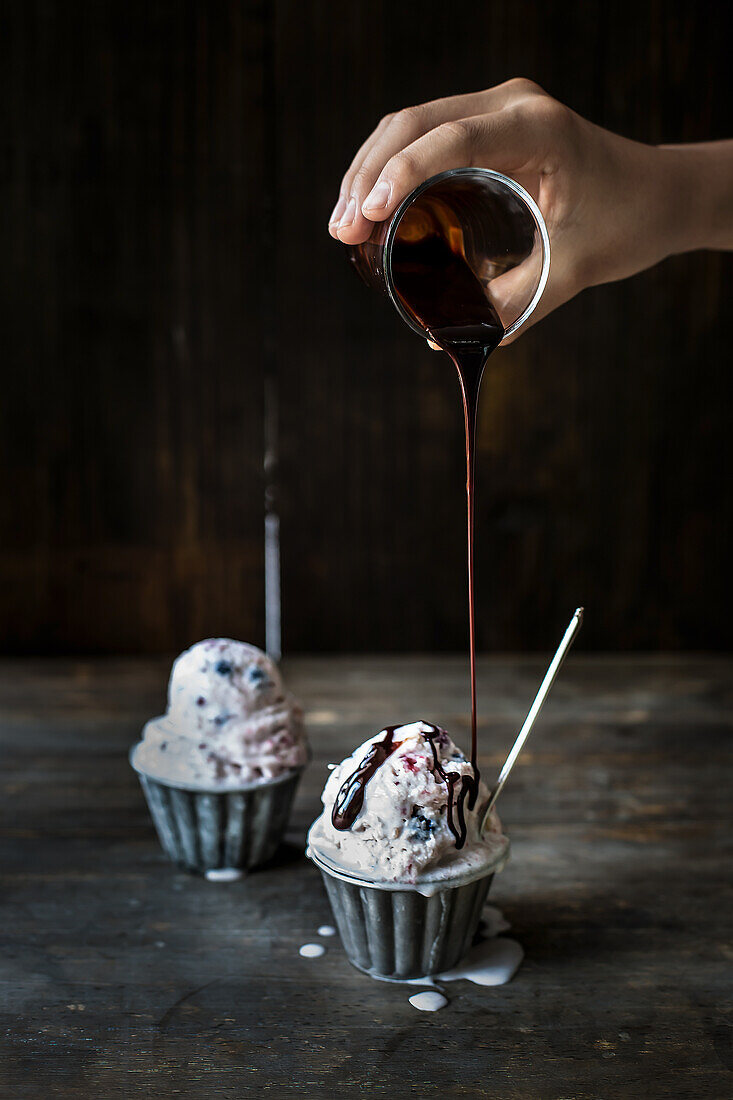 Kombucha ice cream with summer berries and chocolate sauce