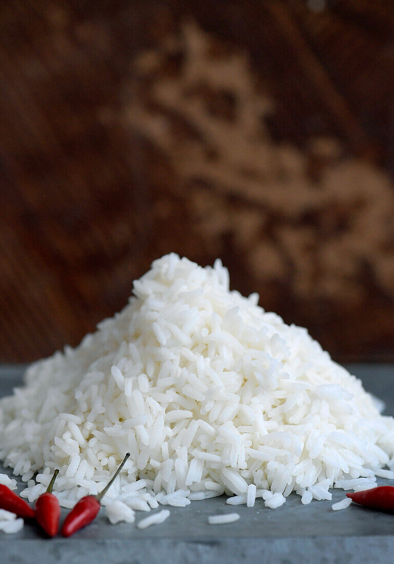 Heap of cooked rice and some chillies