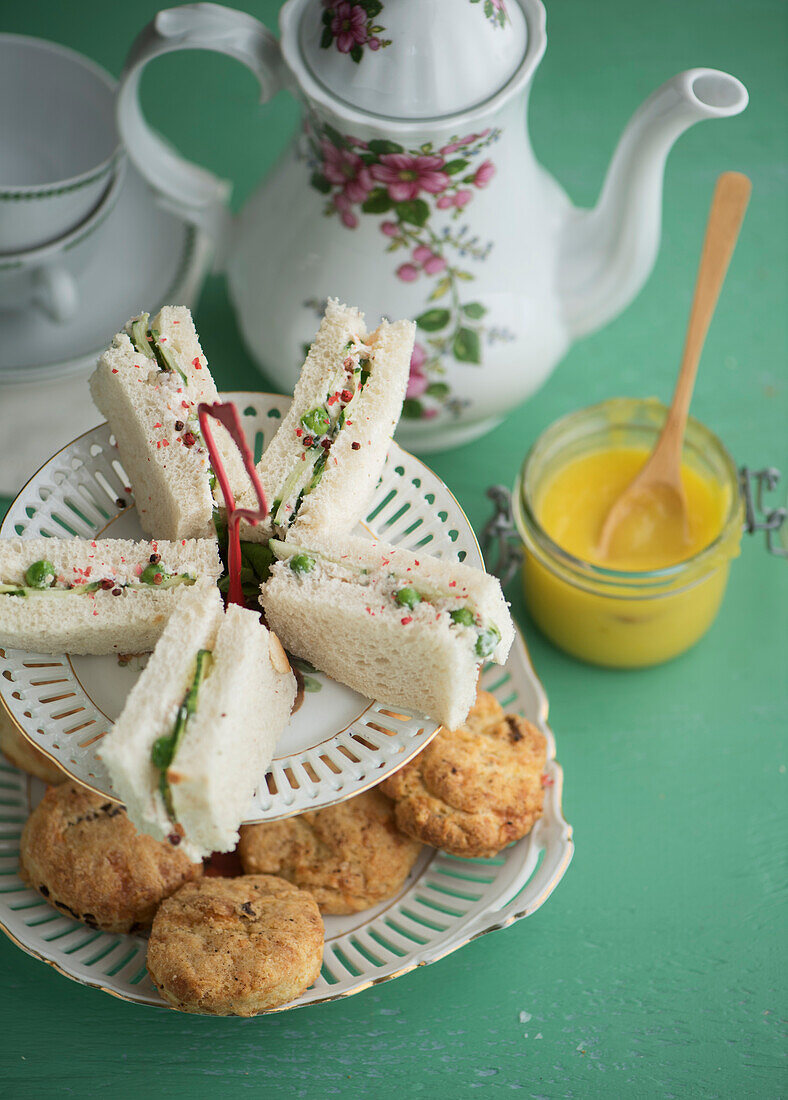 Afternoon tea with cucumber sandwich, scones and citrus curd