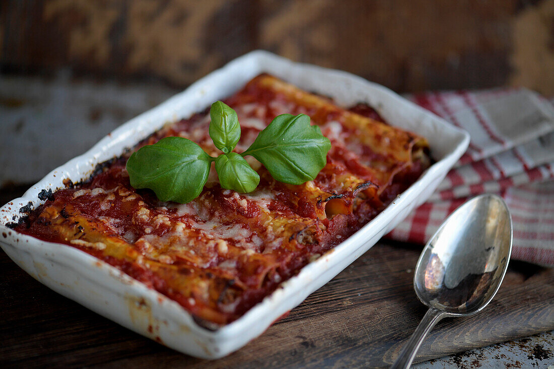 Cannelloni filled with salami, sage-spiced minced meat sauce and tomato sauce