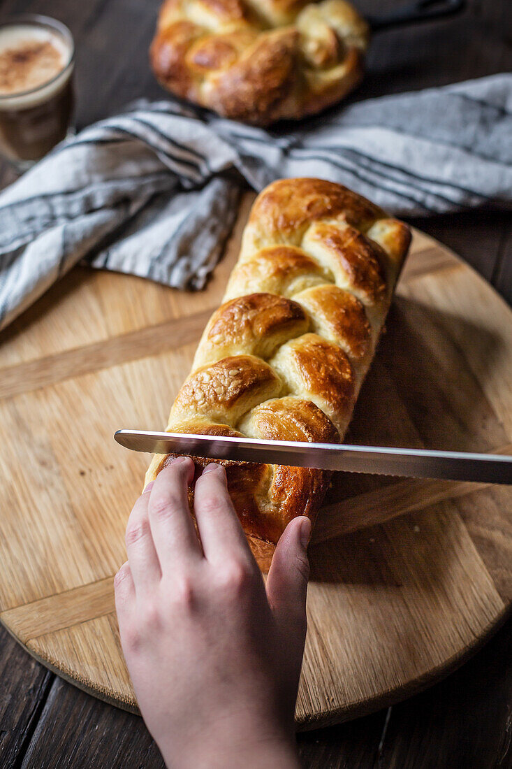 Cutting yeast plait loaf