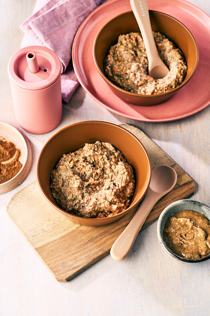 Baby porridge with banana, carrot, peanut butter, chia seeds and cinnamon