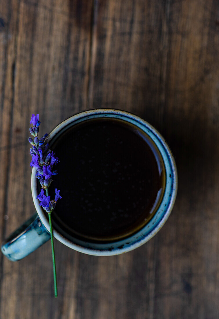 Espresso with lavender blossom on the cup's rim