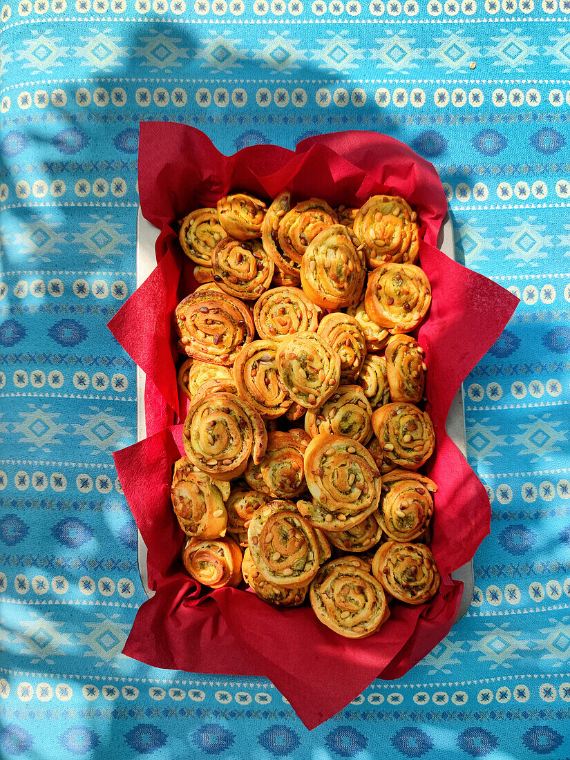 Puff pastry buns with pesto and pine nuts