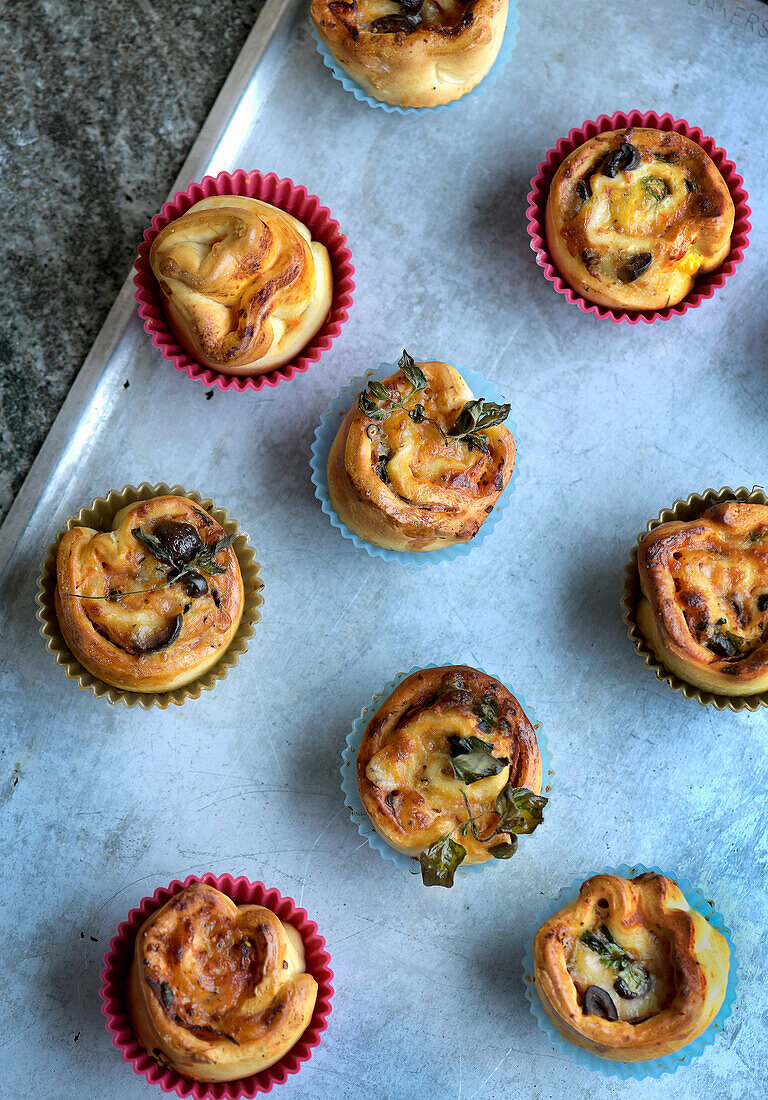 Pizza muffins with salami and olives
