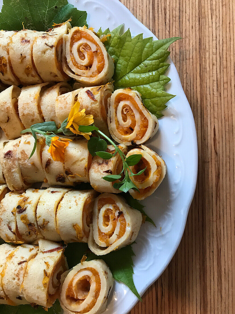 Pancake rolls with pumpkin filling and calendula