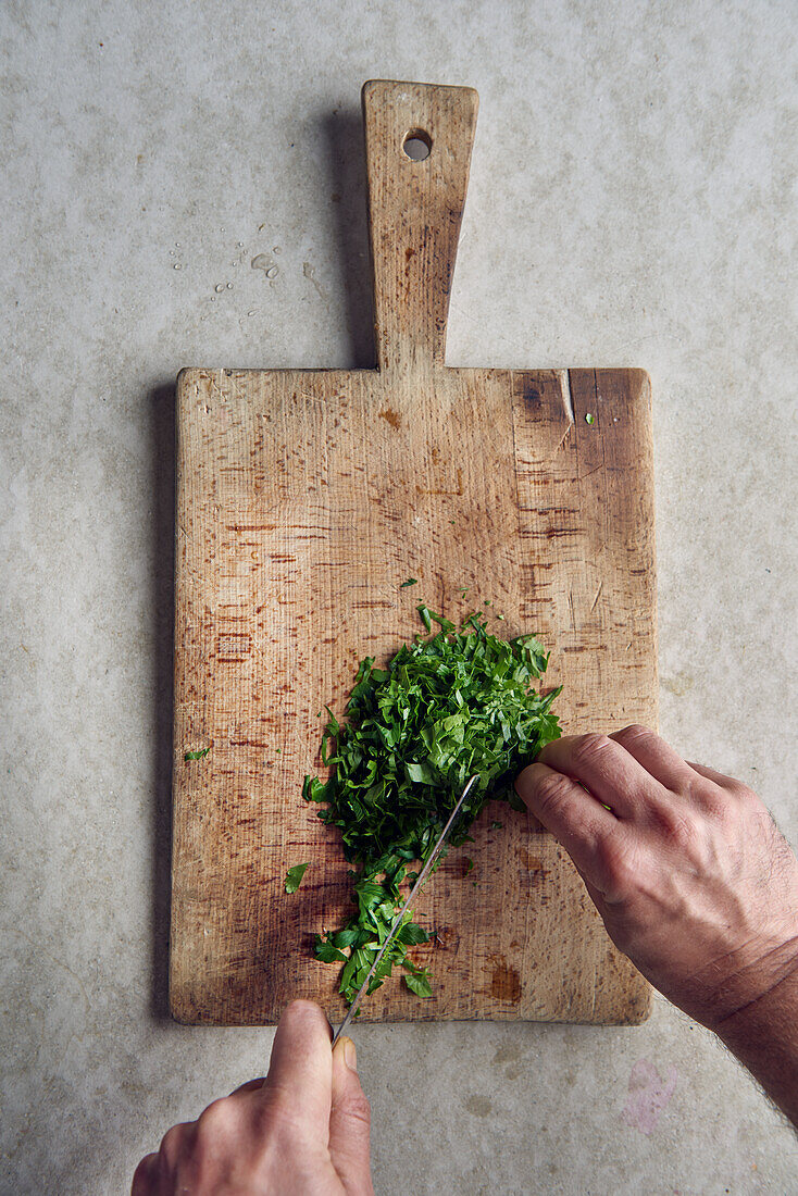 Parsley being finely sliced