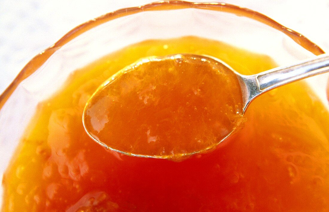Apricot Jam in Bowl and on Spoon