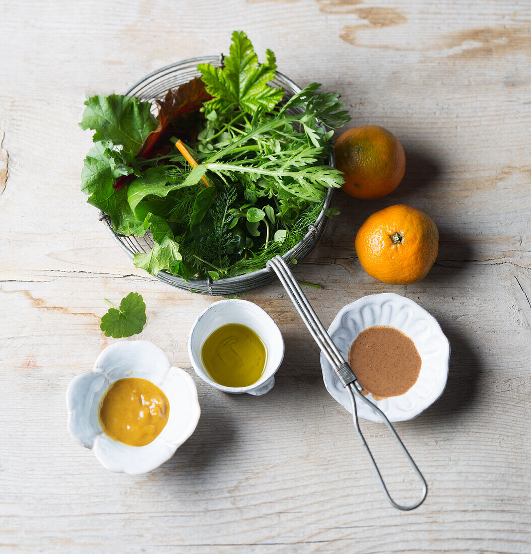 Ingredients for vegan wild herb salad with mandarins