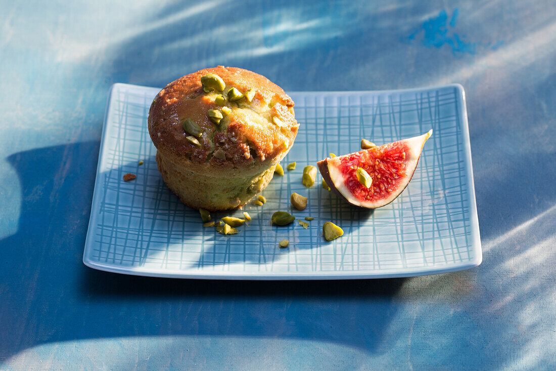 Pistachio tartlet served with fig wedge