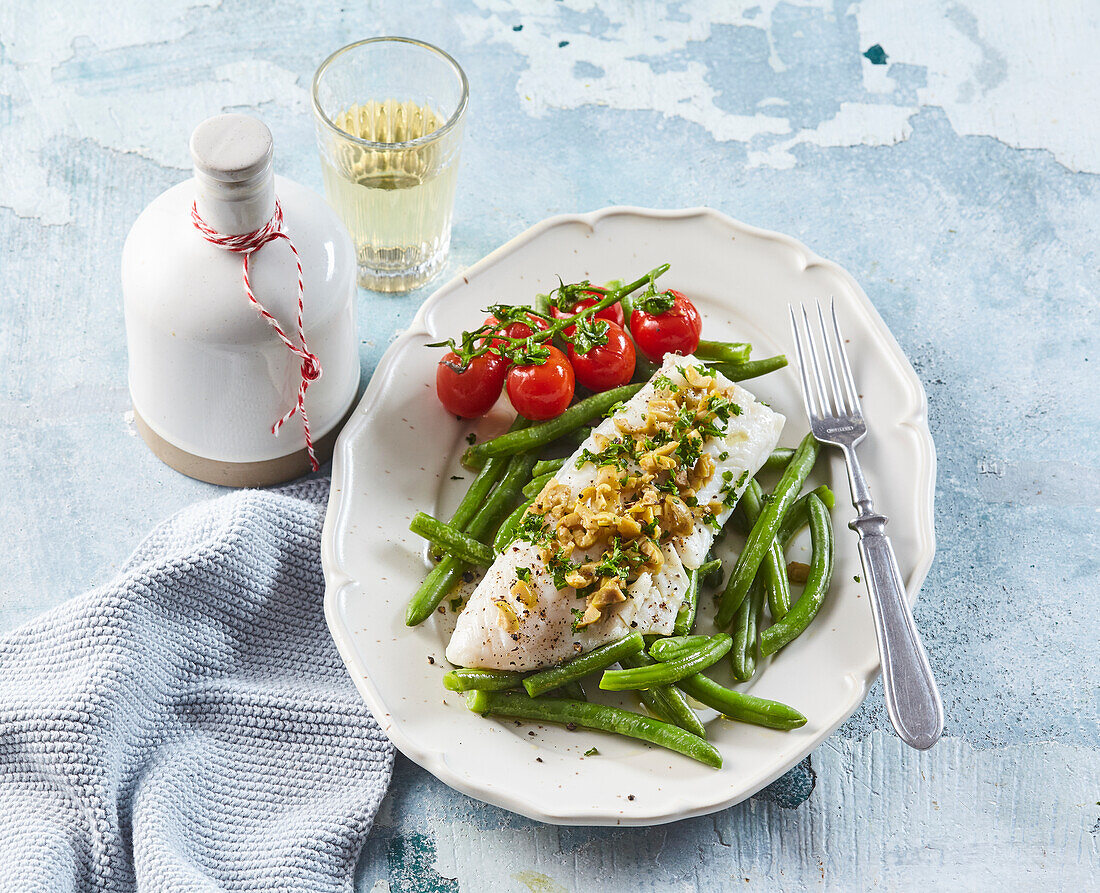 Baked fish fillet with olive salsa