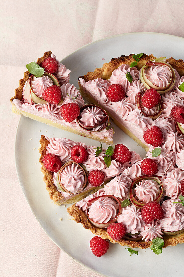 Vegan coconut tart with rhubarb mousse and raspberries