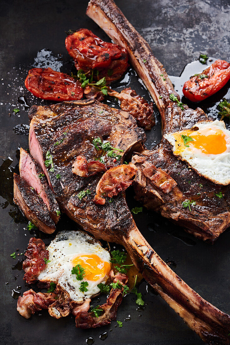 Grilled Cowboy Steaks with Bacon and Fried Eggs