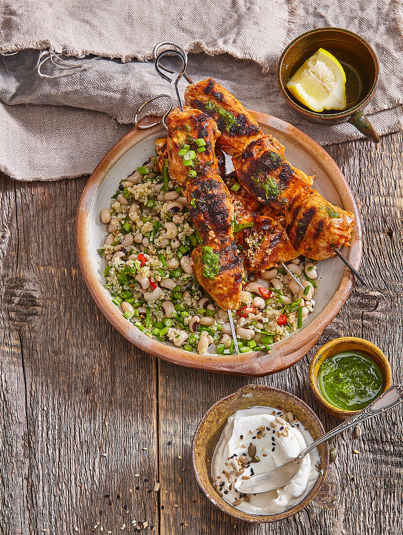 Spicy chicken skewers and quinoa salad