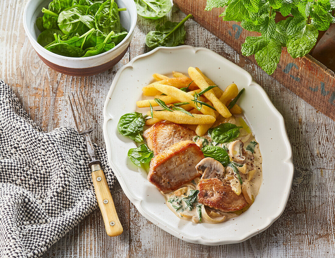 Pork loin with mushroom cream sauce and spinach