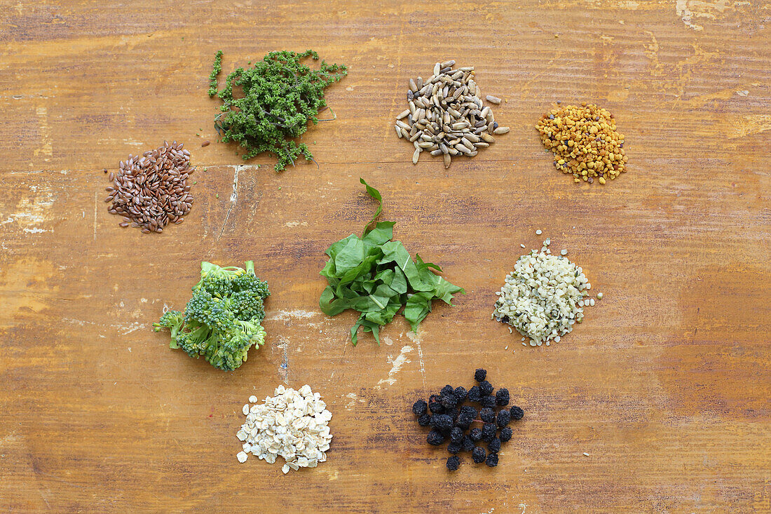 Various superfoods heaped on a wooden base