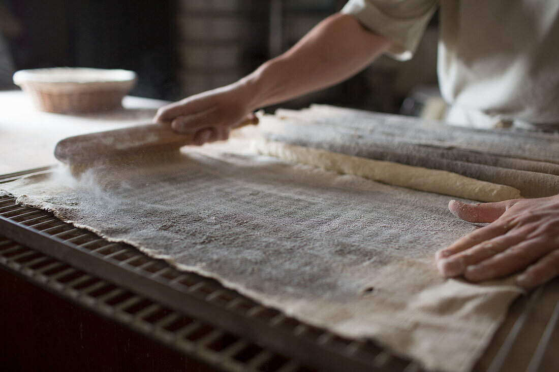 Baker preparing dough in a bakery