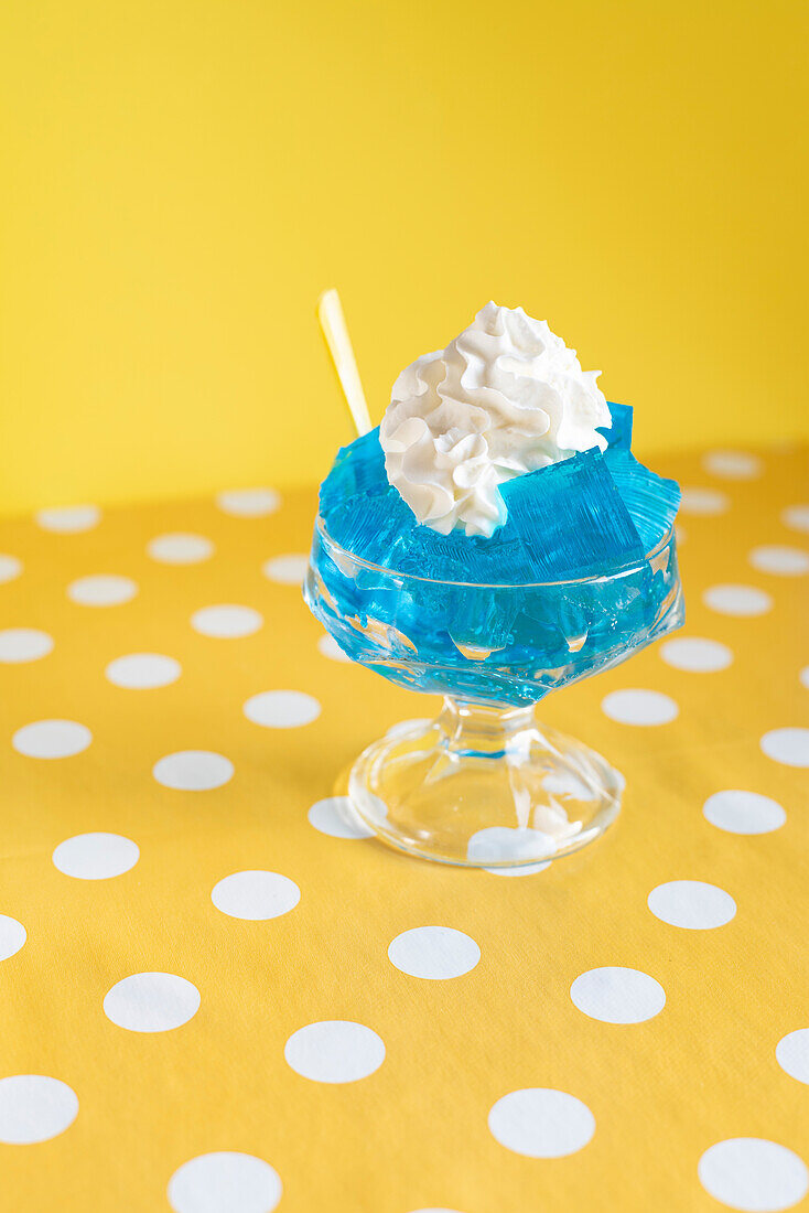Pop art picture of blue jelly with whipped cream