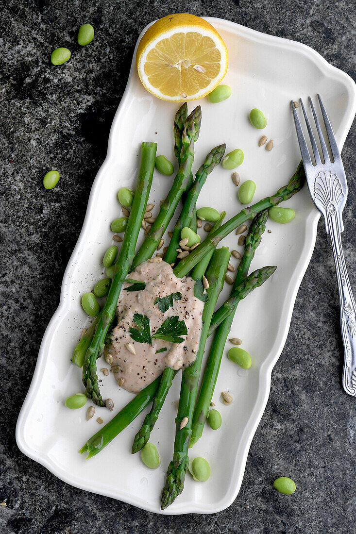 Green asparagus with tuna sauce and edamame