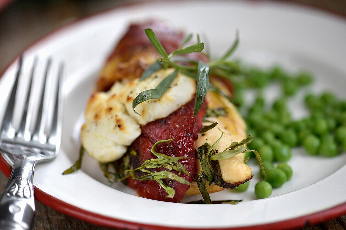 Chicken with roasted peppers, goat cheese Serrano ham and tarragon