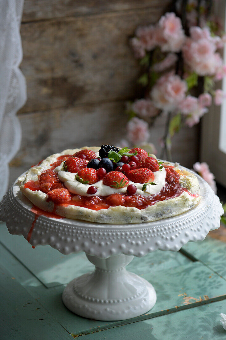 Summer berry flatbread on a cake stand