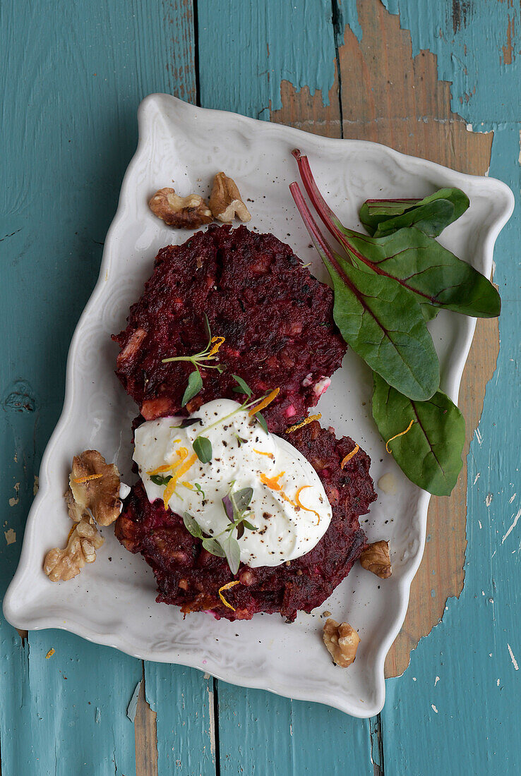 Walnut and beet patties with feta and orange zest