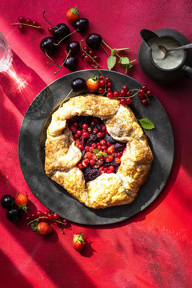 Puff pastry berry galette with berries and cherries