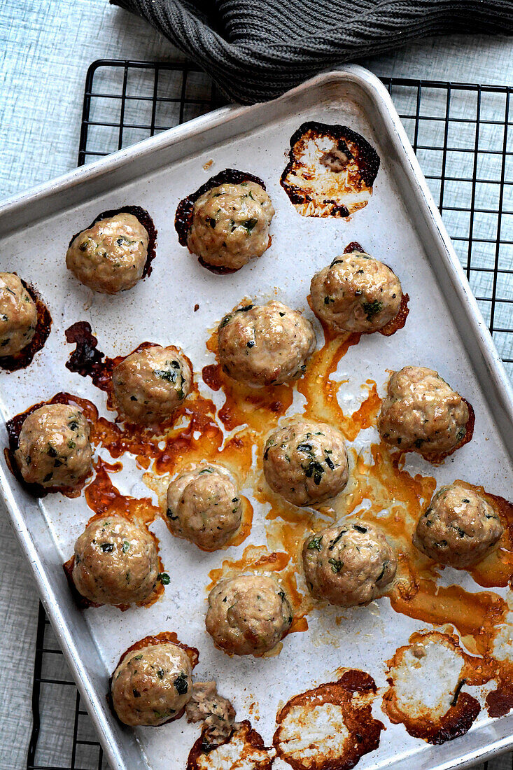 Asian meatballs on a baking tray