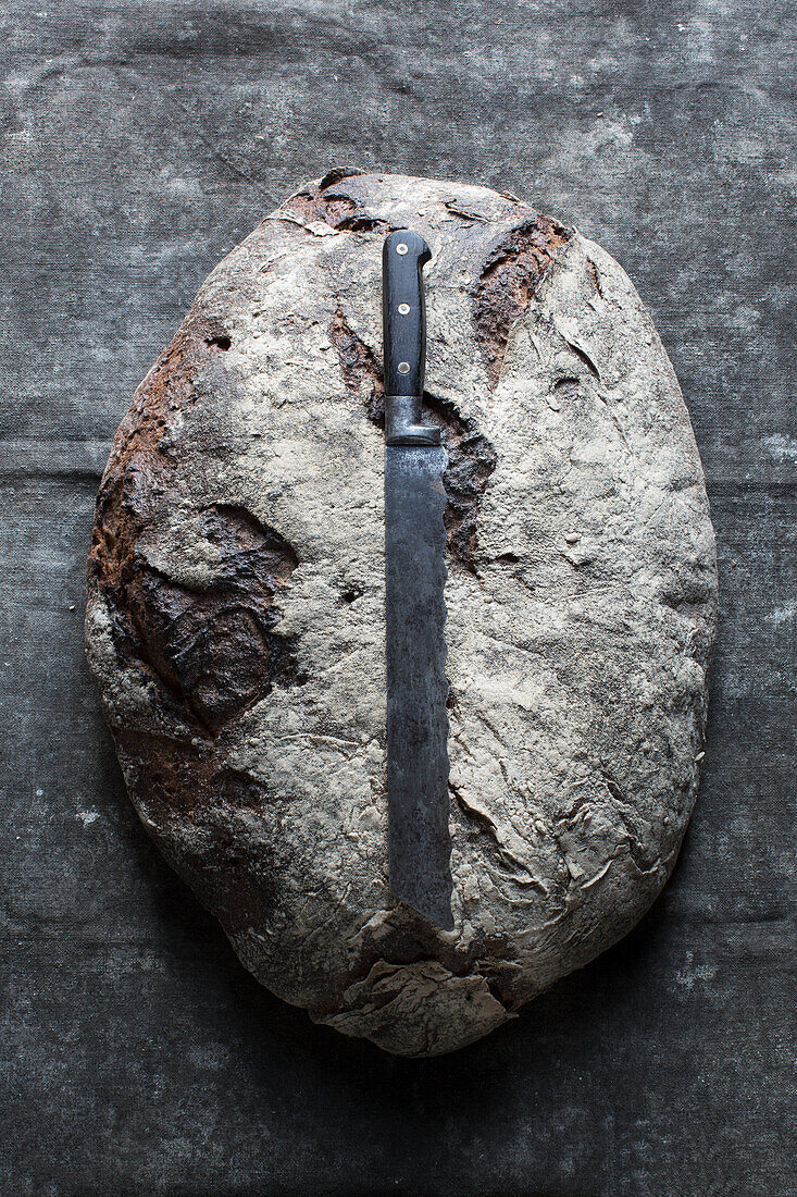 Large rye bread with a bread knife