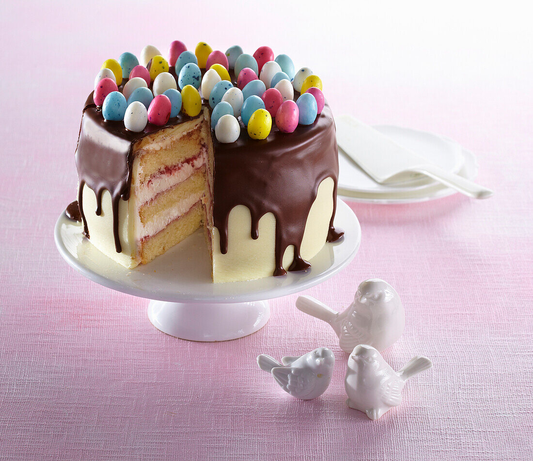 Easter almond dripping cake with Easter egg candy decoration