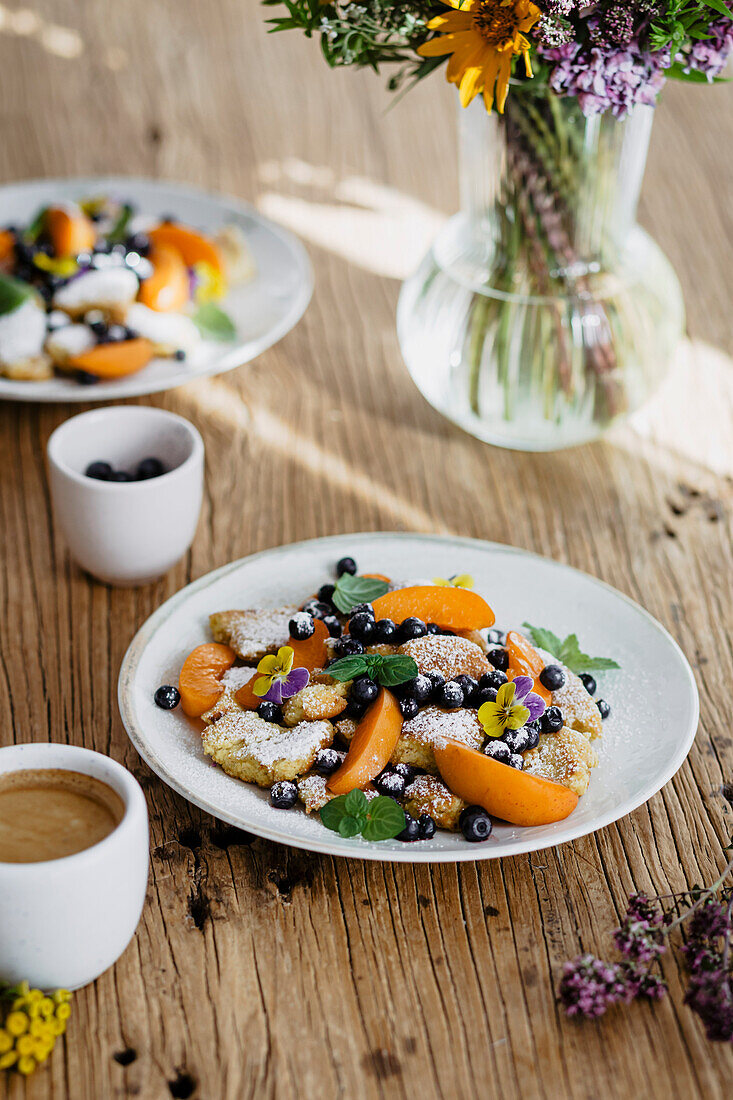 Scrambled pancakes with summer fruits (Kaiserschmarrn)