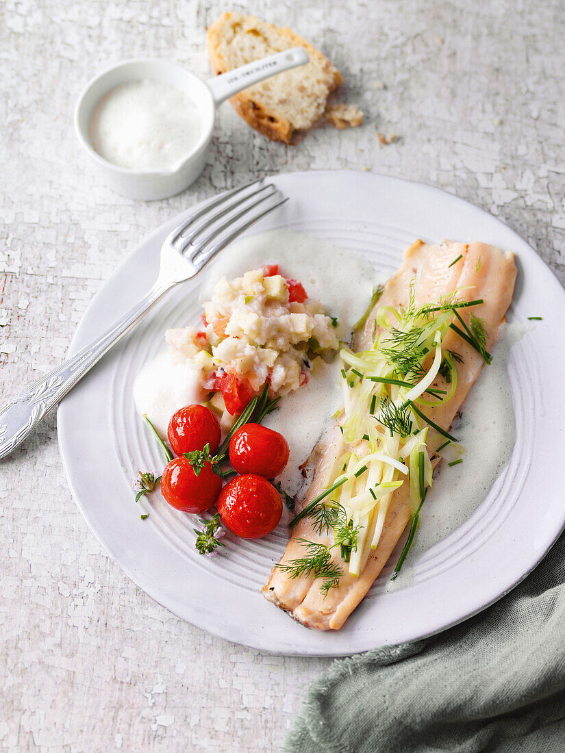 Grilled trout with celery cream and confit cocktail tomatoes