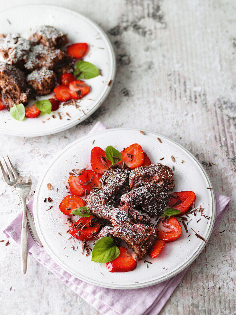 Chocolate pancakes with marinated strawberries