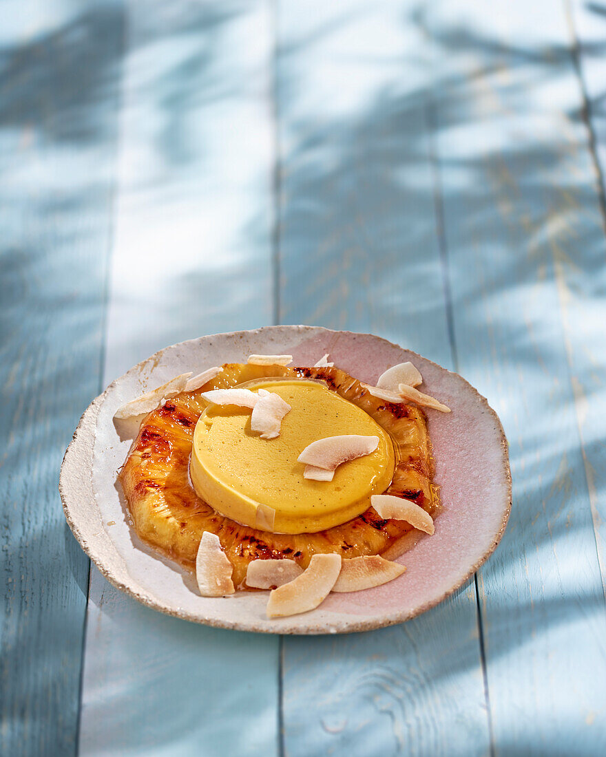 Grilled pineapple with mango vanilla ice cream and coconut