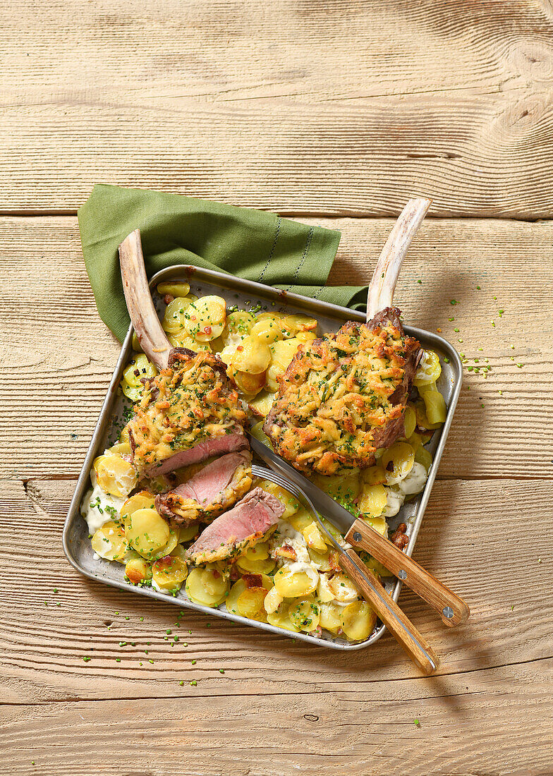 Veal cutlets on a tray with potatoes