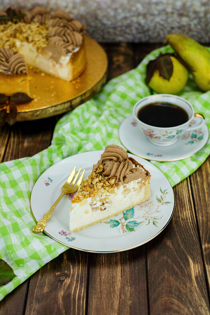 A slice of pear nougat tart with coffee