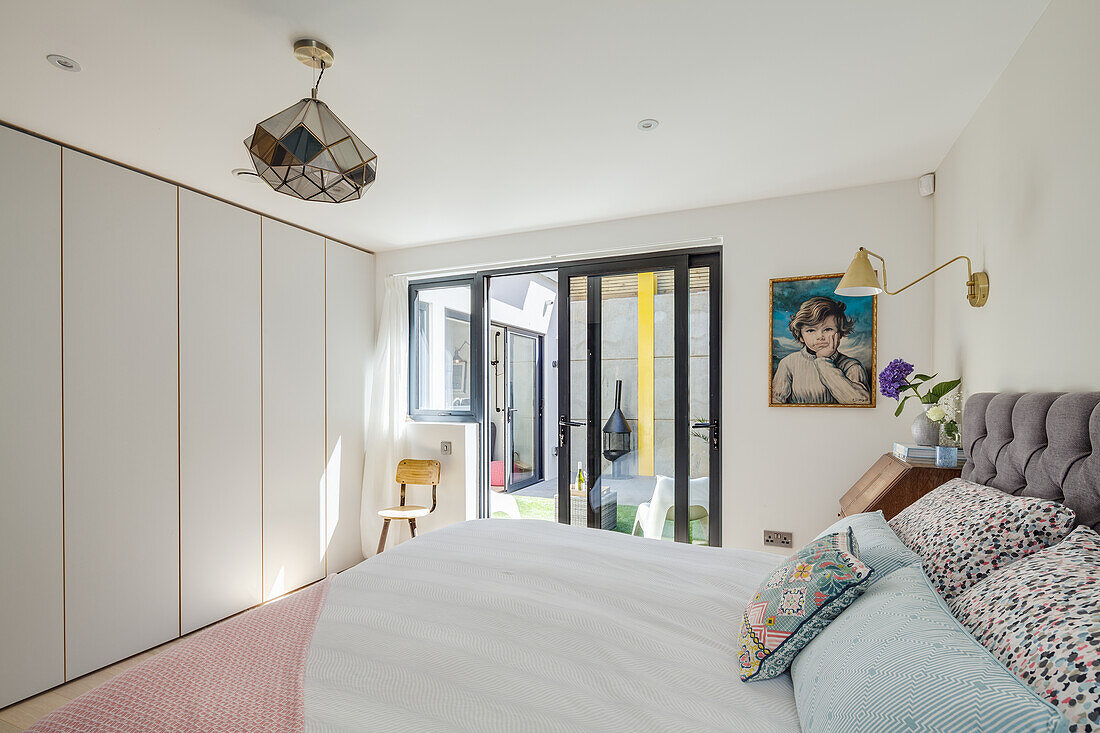 Bedroom with queen bed and built in closets in the basement