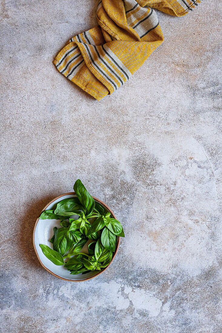 Basil leaves in a small bowl