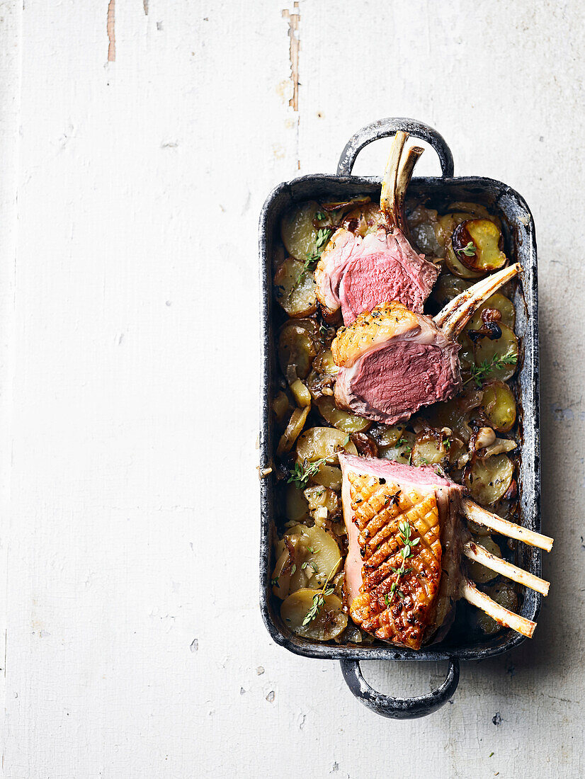 Rack of lamb with new potatoes, onions, and thyme