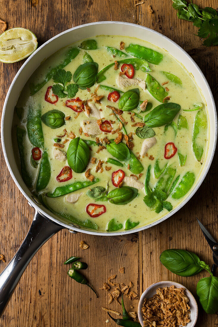 Homemade Thai green chicken curry in a pan