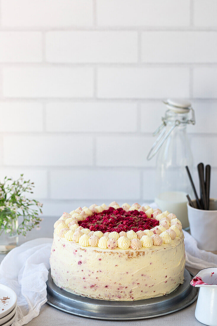 Raspberry Layered Sponge Cake with vanilla frosting