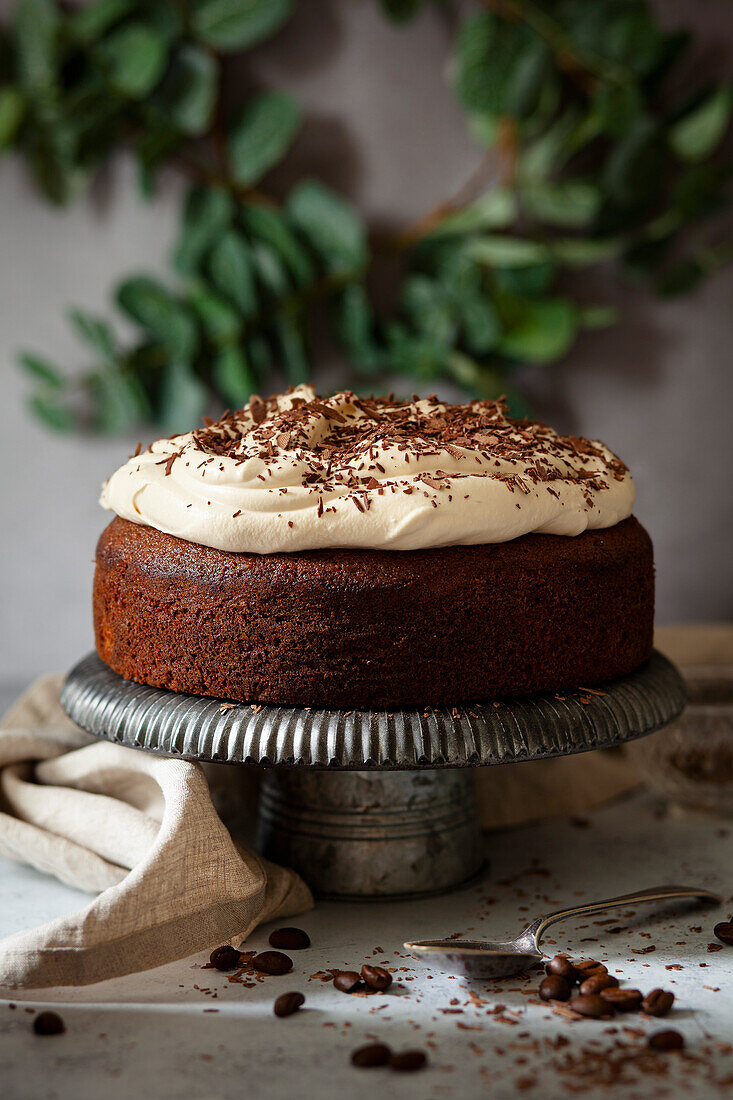 Irish coffee cake with whipped cream and grated chocolate