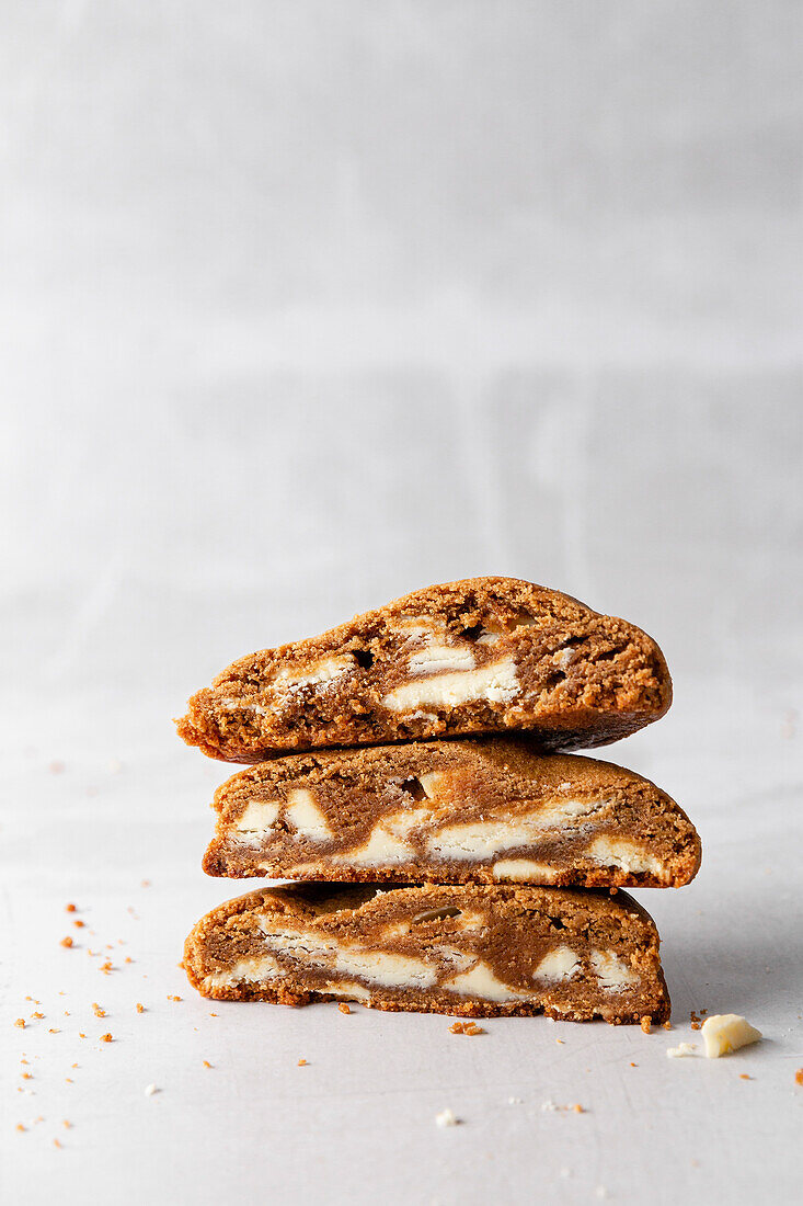 Gingerbread and white chocolate cookies stacked